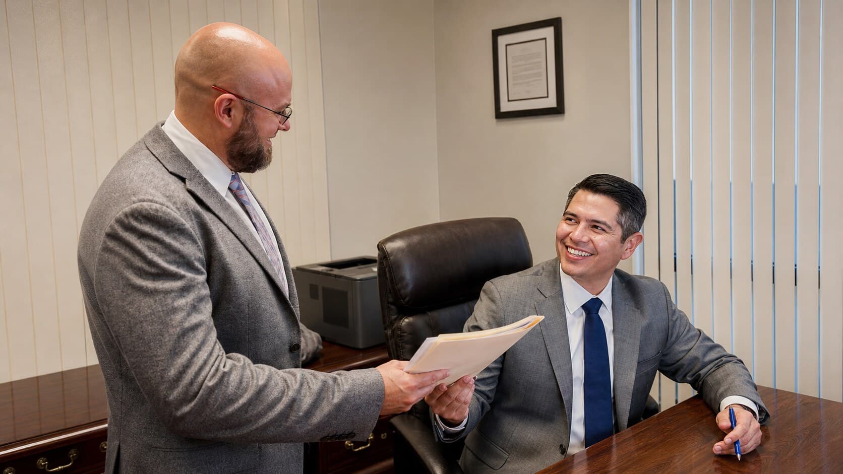 Ruiz Law attorneys reviewing an injury claim together